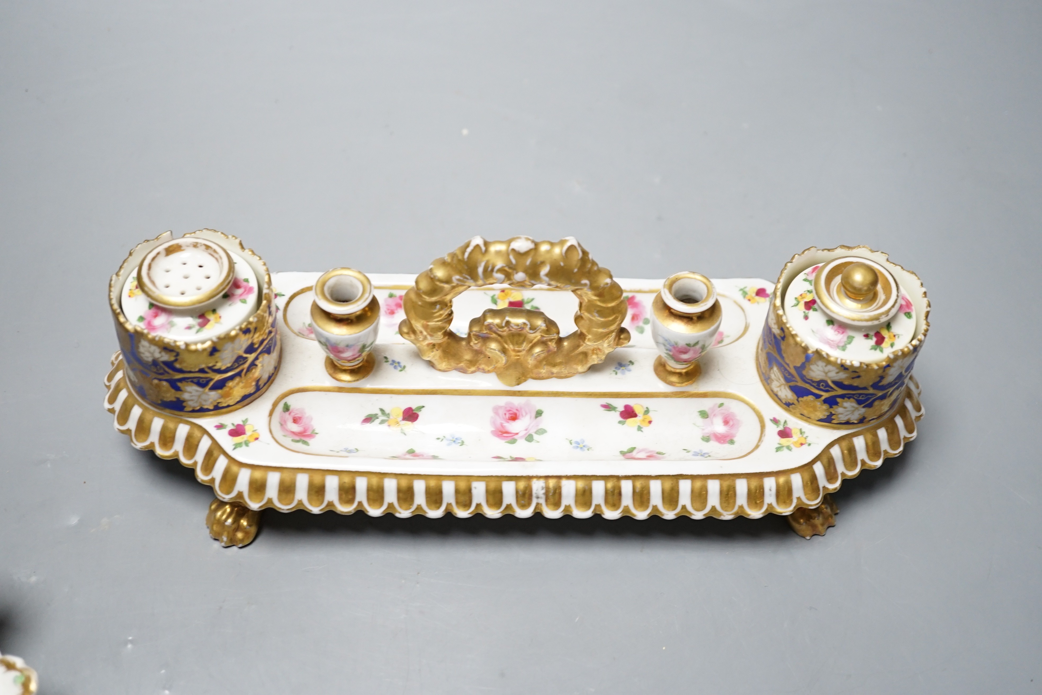 A 19th century Chamberlain Worcester inkstand painted with roses and heatsease, script mark, and a 19th century English porcelain leaf shaped inkwell with strawberry shaped wells, encrusted with flowers picked out in gil